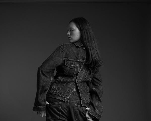 Beacasso's studio portrait of a woman in denim on the Fujifilm X-T50