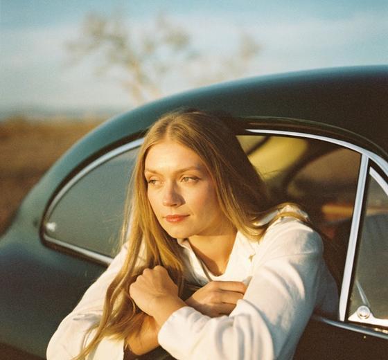 KJ in a vintage car at sunset shot by Natalie Carrasco.